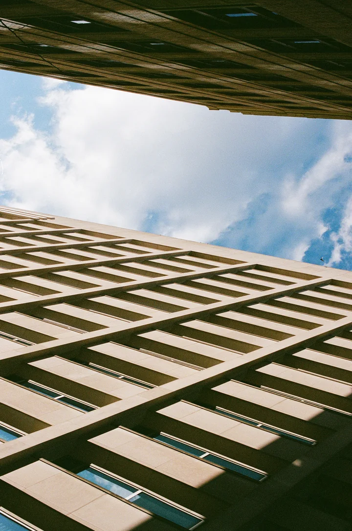 Looking up at the grid of a building facade