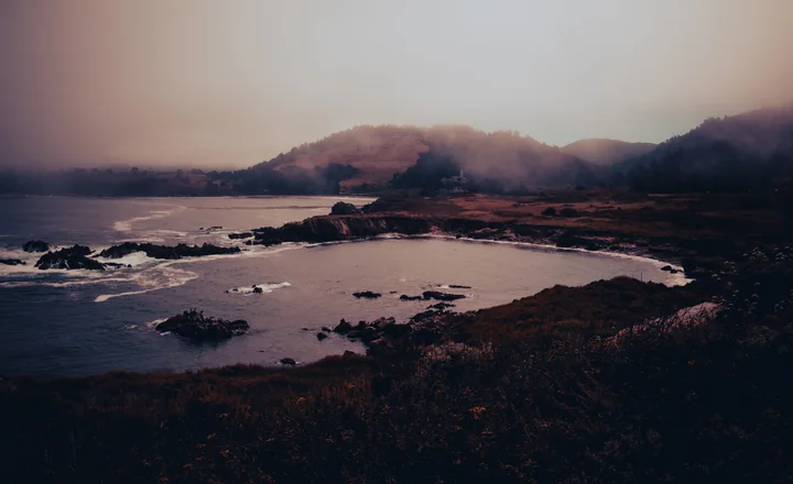 A misty cove at dusk